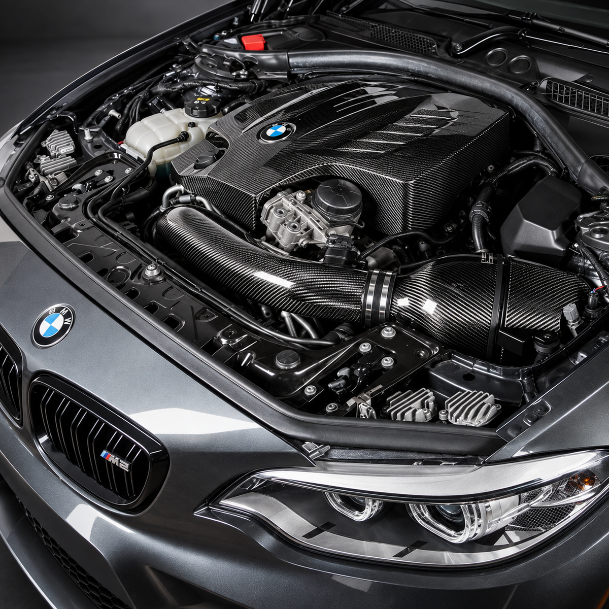Illustrative N55 engine bay; carbon styling not included