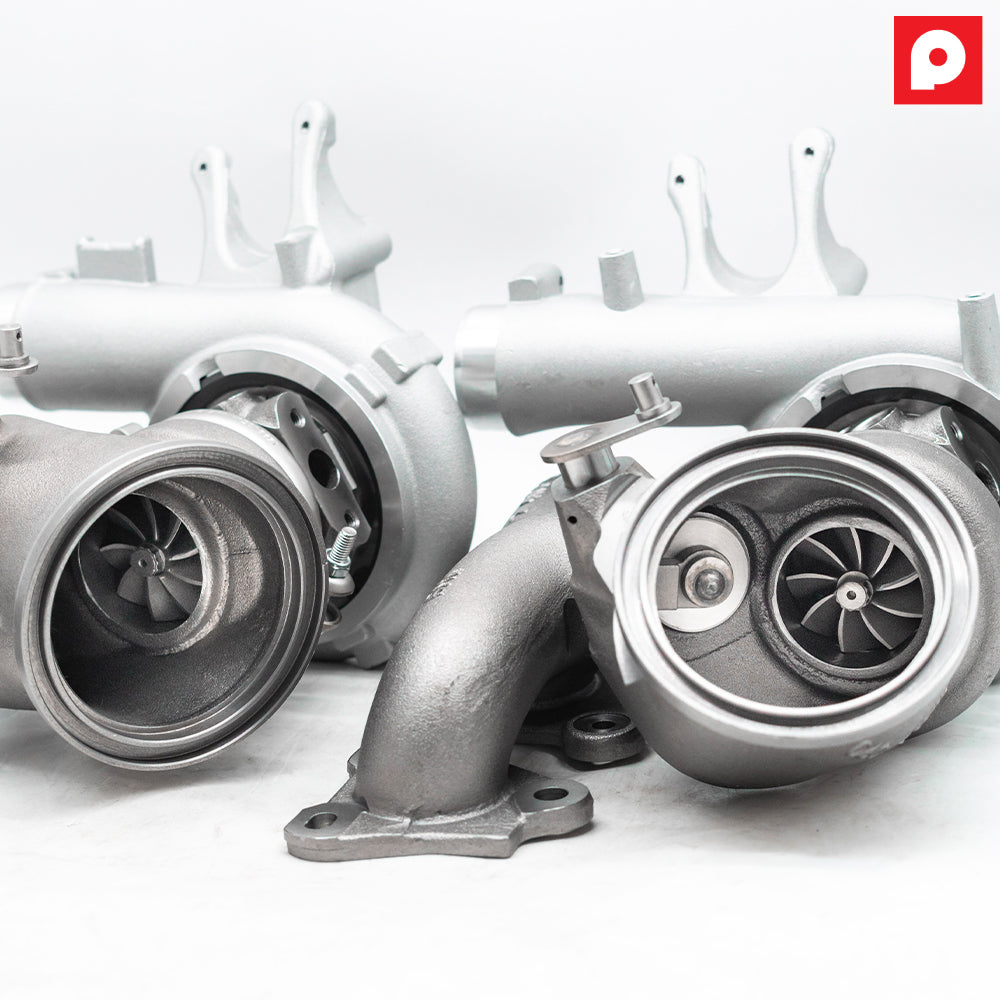 Rear view of the Pure800 cast turbo pair for BMW S55, showing the turbine outlets