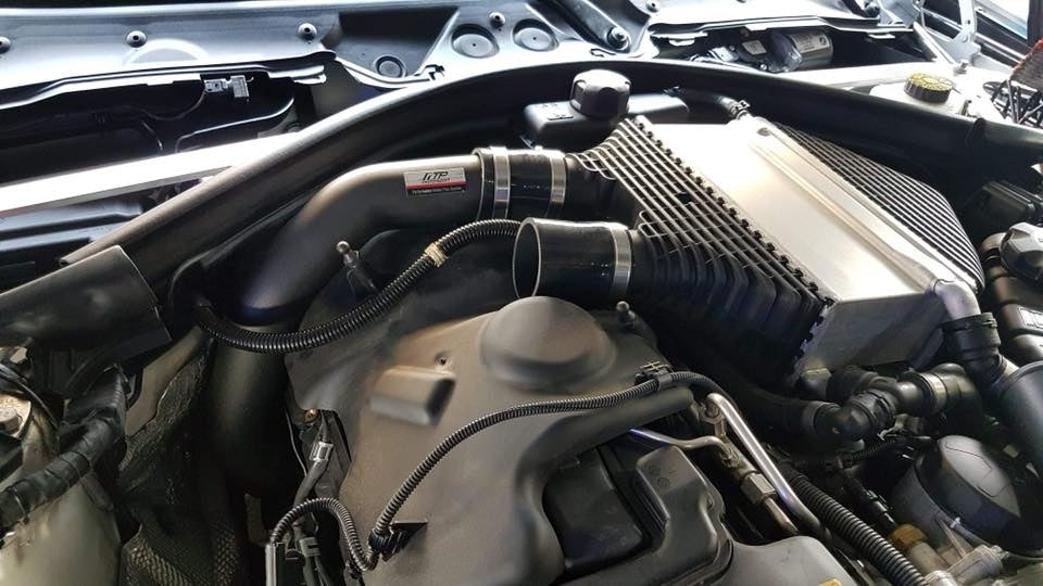 FTP S55 black charge pipes fitted beside the original charge cooler