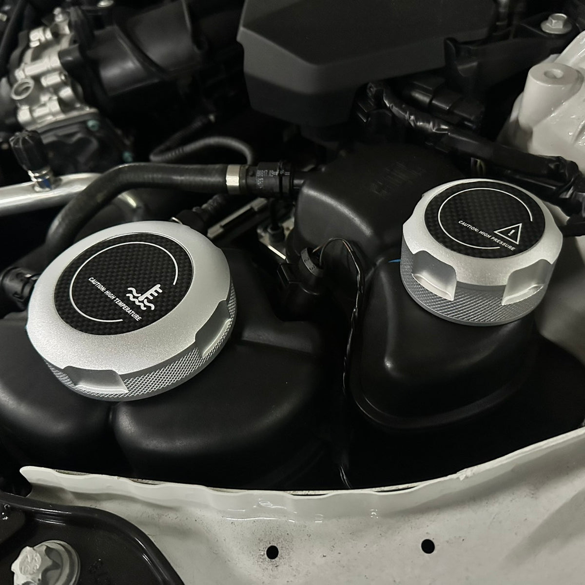 FTP silver MaxCap coolant covers installed; surrounding vehicle parts not included