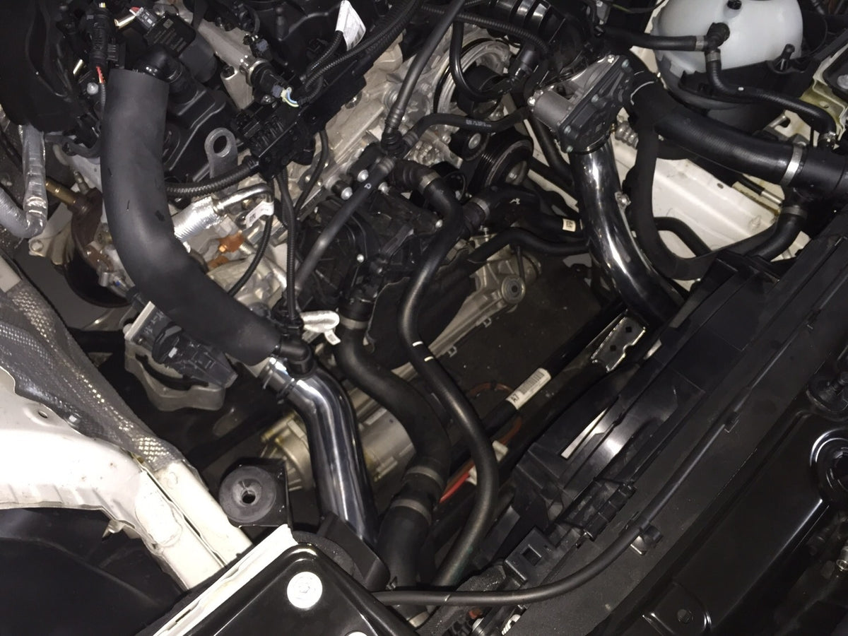 FTP B38 charge-pipe routing installed; surrounding components not included