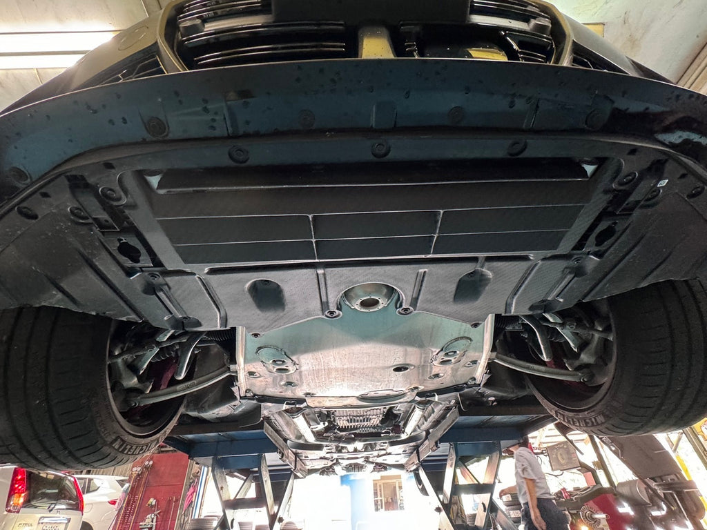 FTP carbon oil-cooler guard installed beneath a BMW G8x